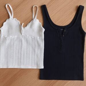 Abercrombie & Fitch black tank top and Aritizia white tank top.